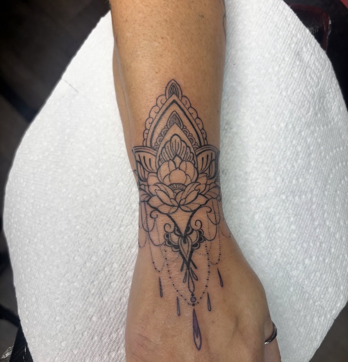 Decorative floral wrist tattoo